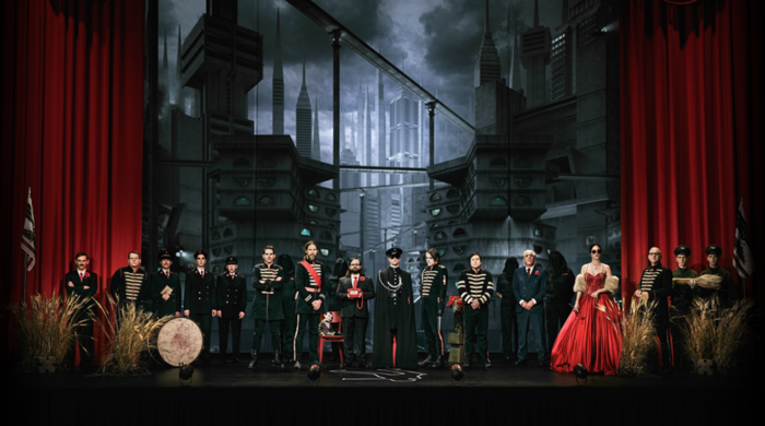 group of people on a stage in military uniforms